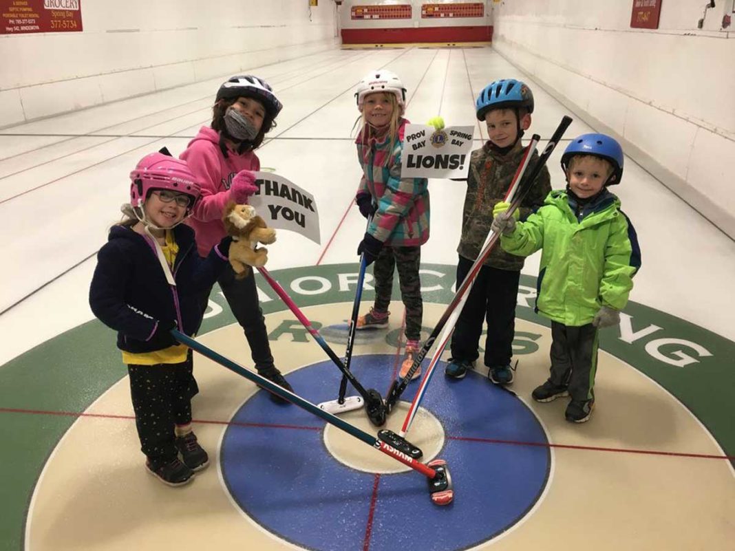 THANK YOU, LIONS! Youngsters in the Providence Bay Youth and Junior Curling Club are all smiles and hold up thank you cards to the Providence Bay and Spring Bay Lions Club for their support.