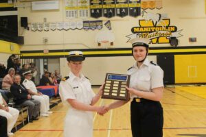 Acting sub-lieutenant Miranda Mackay, left, presents the Manitoulin Navy League branch outstanding third year cadet award to Petty Officer second class Elizabeth Hazlitt. photo by Michael Erskine.