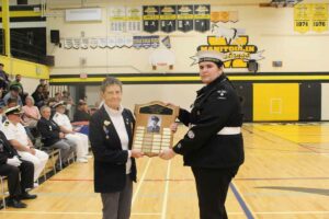 The George Bury Memorial Award is presented by Sue Morin, left to Chief Petty Officer Second Class Savannah Crack. photo by Michael Erskine.