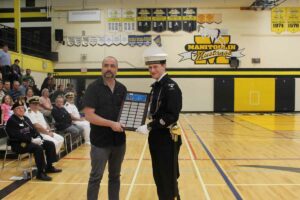 The Ed Kift Esprit de Corps Award is presented by his son John Kift, left, to Chief Petty Officer Second Class Rhys Allison. photo by Michael Erskine.