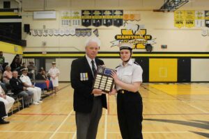 The Top Marksmanship Award was presented by marksmanship coach CI Denis Blake, left, to Petty Officer Second Class Elizabeth Hazlitt. photo by Michael Erskine.