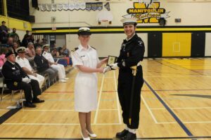 Acting Sub-lieutenant Miranda Mackay, left, presents the Sportsmanship Award to Chief Petty Officer Second Class Lydia Pennings. photo by Michael Erskine.