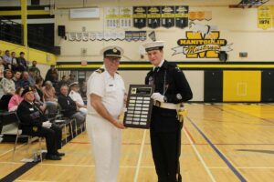 The Outstanding Top Cadet Award is presented by Commanding Officer Lieutenant Sylvain Boucher, left, to Chief Petty Officer Second Class Rhys Allison. photo by Michael Erskine.