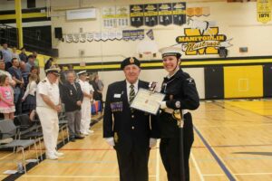 The Lord Strathcona Trust Fund medal is the highest award which can be bestowed upon a cadet in recognition of exemplary performance in physical and military training. In photo reviewing officer Roy Eaton, left presents the award to chief petty officer second class Lydia Pennings. photo by Tom Sasvari.