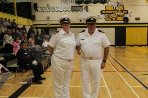 Acting sub-lieutenant Tina Davidson, left in photo, presents the Commonwealth Cadet Officer Medal to Commanding Officer Lieutenant Sylvain Boucher.