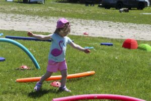 This youngster was one of many who enjoyed the kids obstacle course at the Service Providers day event. photo by Tom Sasvari.