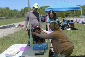 Public Health Sudbury and Districts (PHSD) provided free bicycle helmets to youngsters at the service Providers Day event. photo by Tom Sasvari.