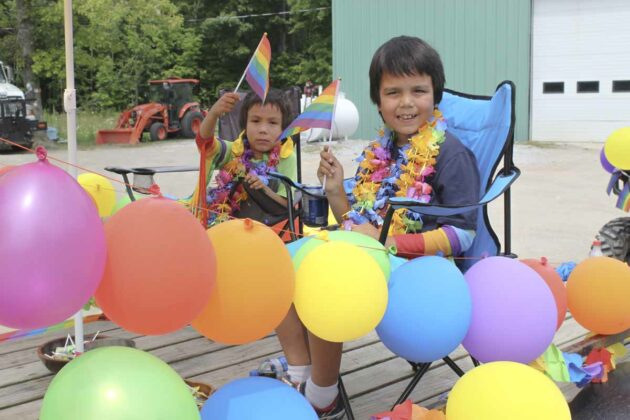 Thomas and Cole Panamick are shown on one of the floats at the Sheshegwaning Pride Parade.