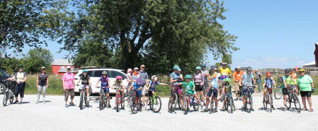 Participants in the Tour de Barrie Island pause for a photo before the start of the event.