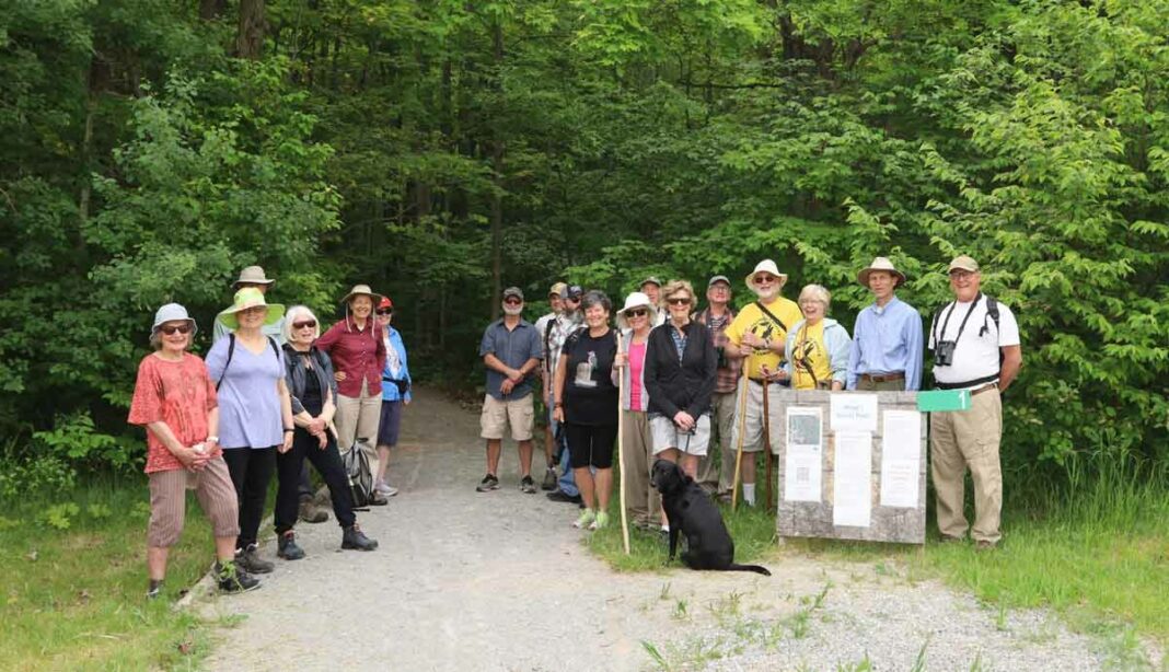 The Wagg’s Woods Trail committee along with other interested parties are shown at the entrance to the trail. photo by Maggie Leclair