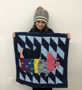 Chloe Moggy with her quilt.